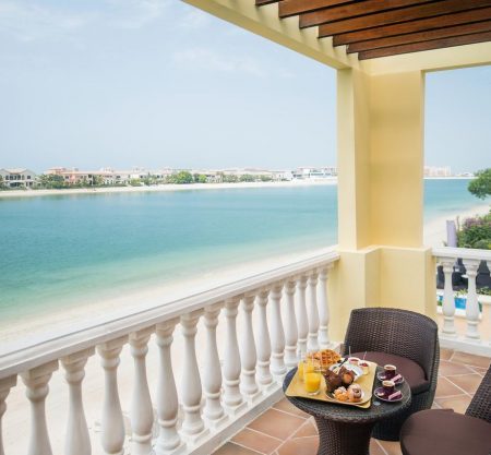 Beachfront balcony with breakfast and ocean view