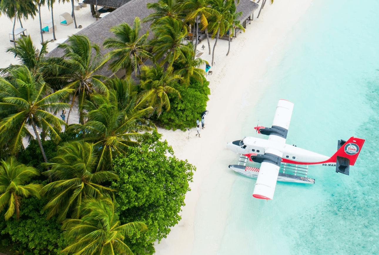 Seaplane on tropical island beach