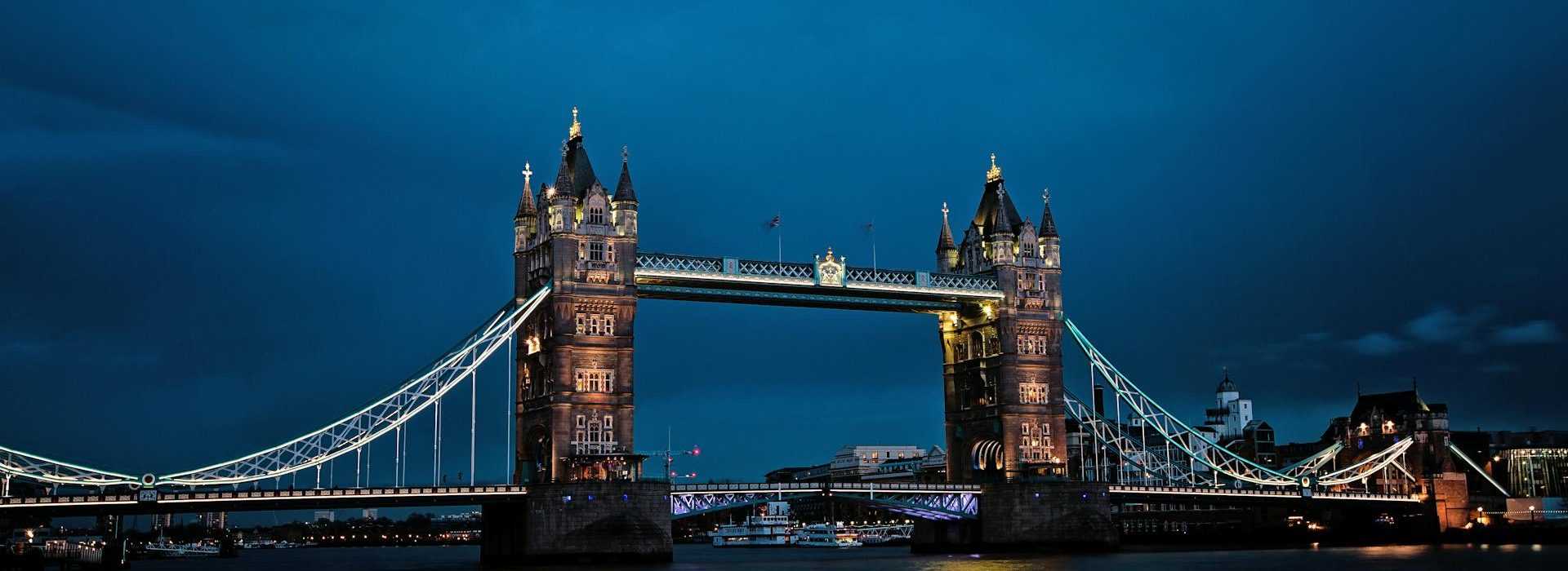 Tower Bridge illuminated at night in London, England.